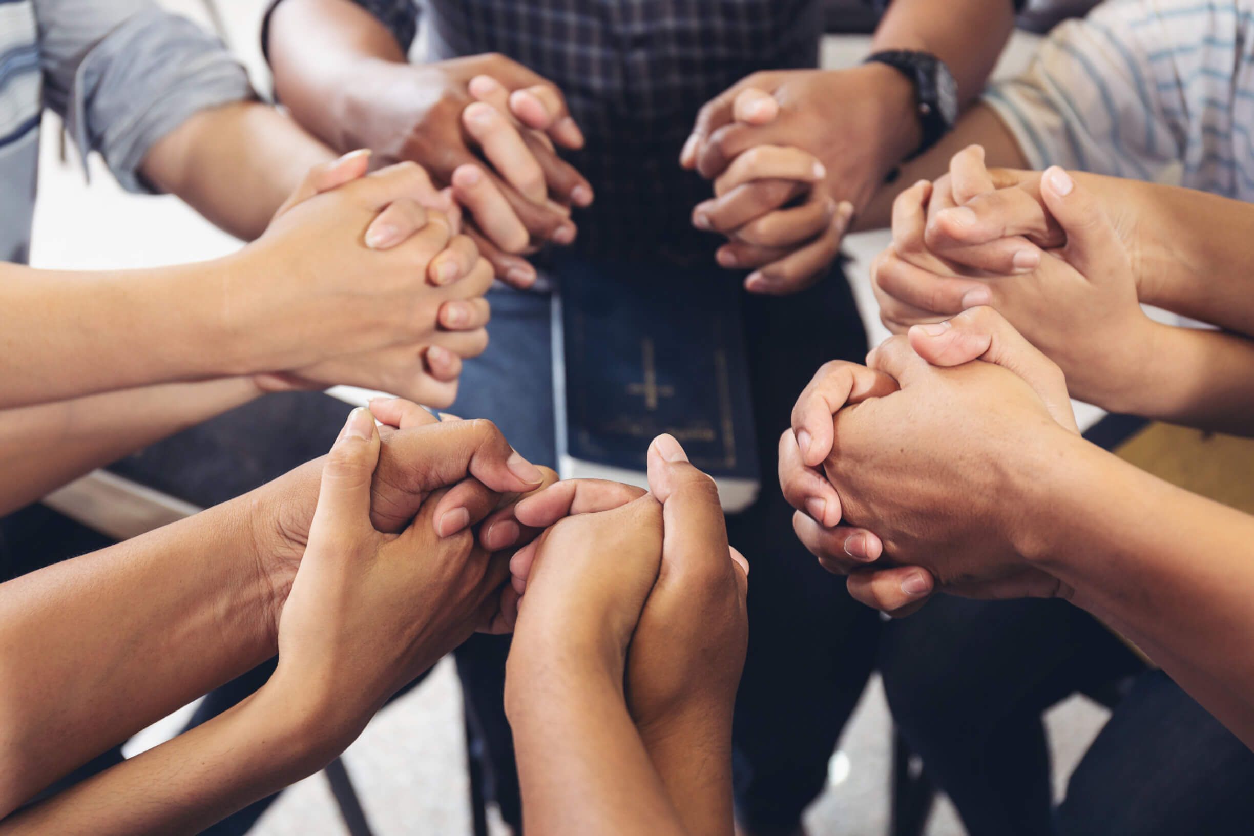diverse hands holding hold hands circle to pray for God each oth