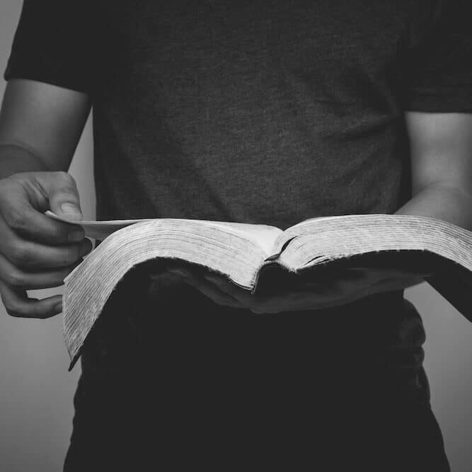 Vintage tone of man reading the Holy Bible.